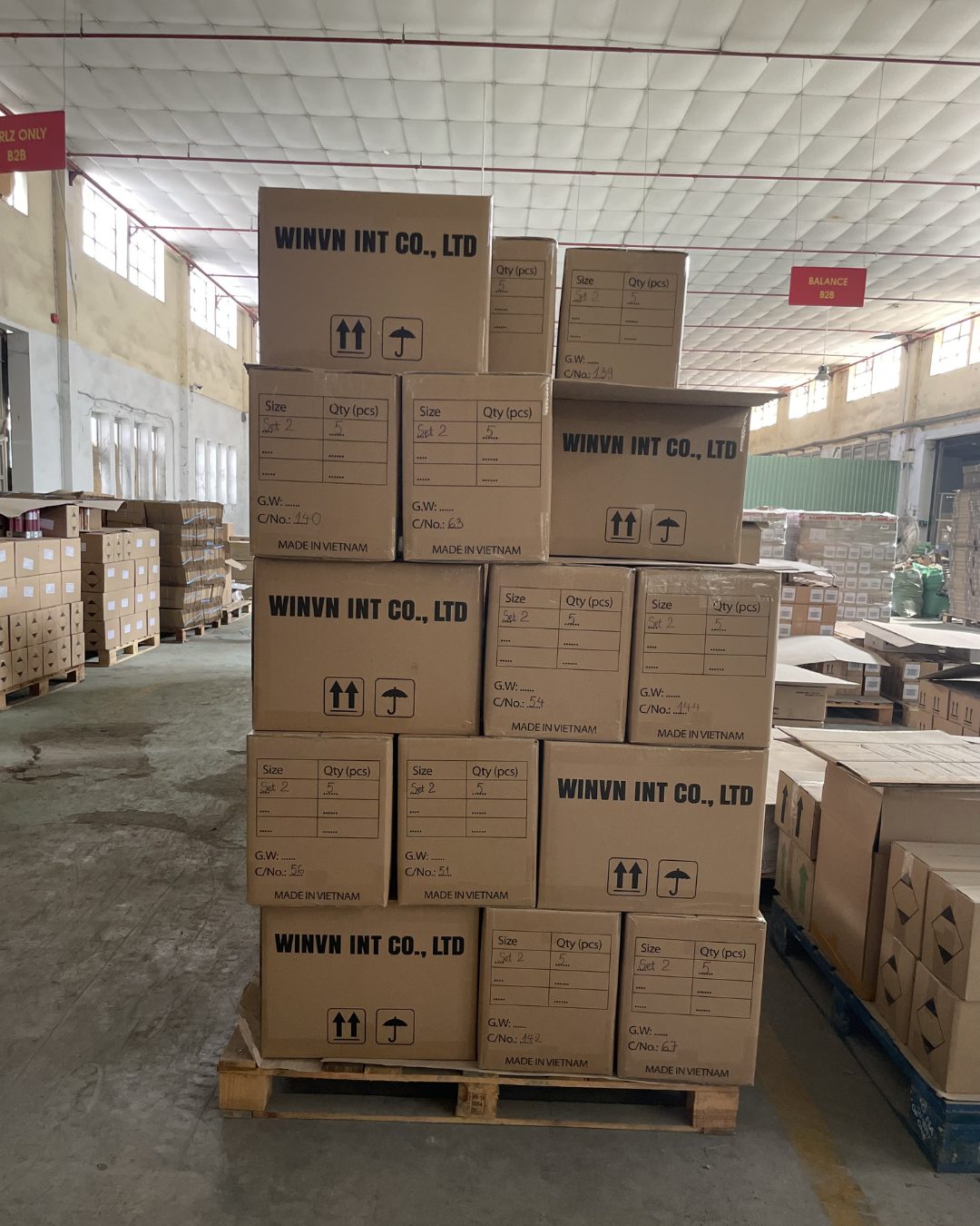 Warehouse pallets of packed WINVN INT CO., LTD export cartons