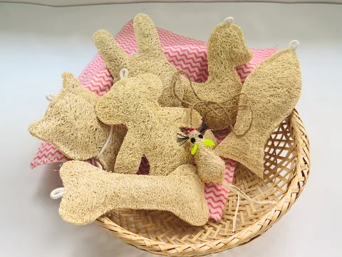 Loofah cat-play shapes in a basket on a light surface